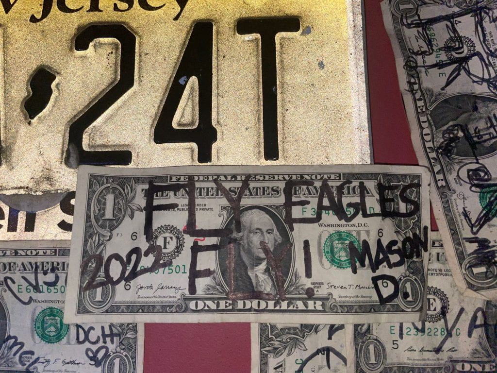 A dollar bill with Mason's signature.