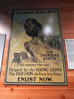 A propaganda poster with an image of three lions. 