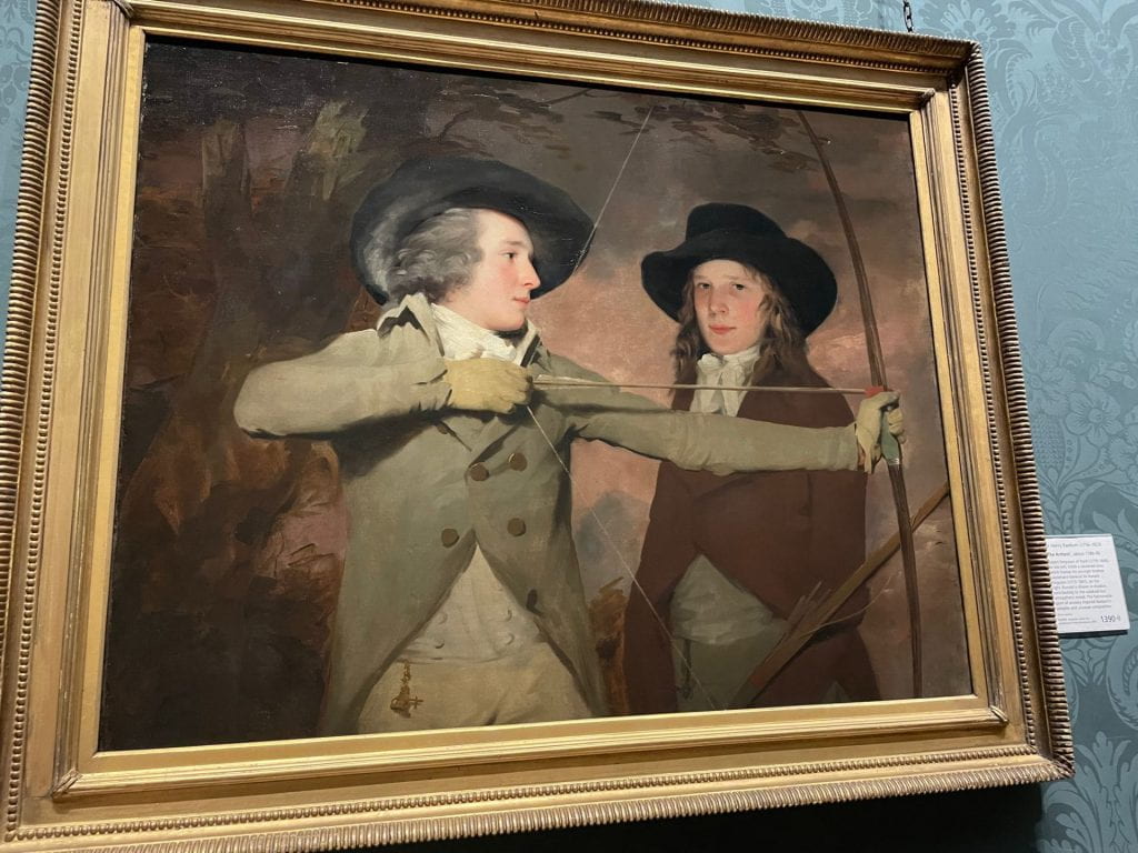 A painting of two young men with a bow.