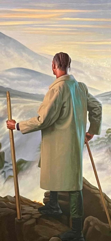 A close up of Wiley's painting of a young black man on a mountain