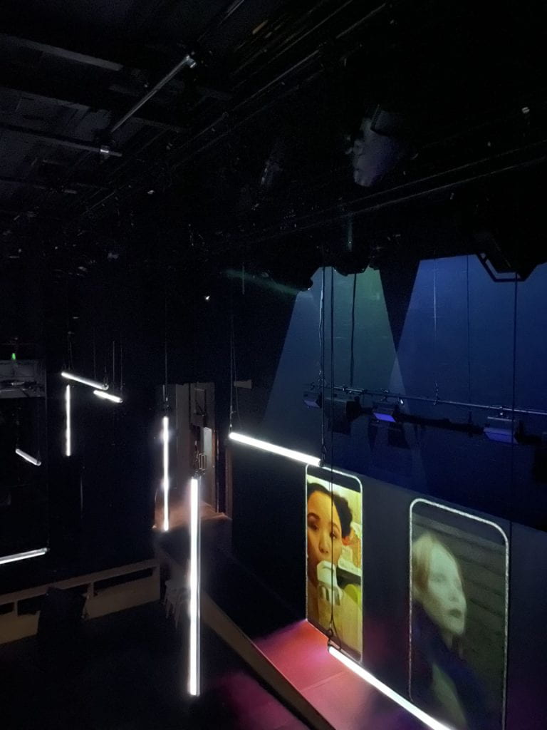 The stage of Our Generation features large phone screens
